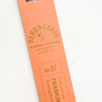 Frankincense: A salmon pink packaging sleeve containing frankincense scented incense.