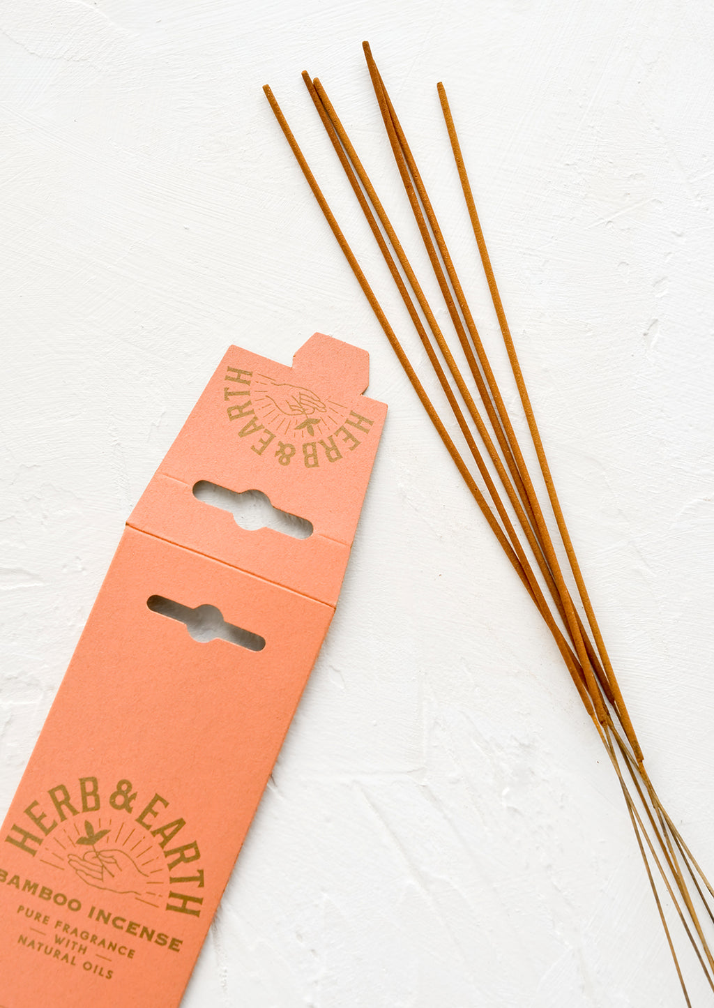 3: Long, skinny sticks of dipped incense on bamboo sticks.
