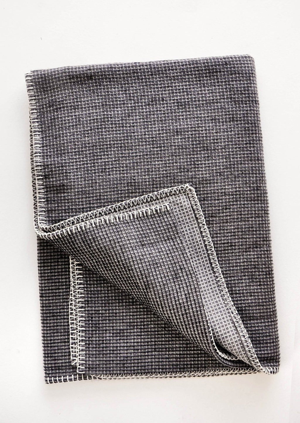 Dark Grey: Waffle Textured Cotton Blend Blanket in Charcoal with White Whipstitch Trim along edges