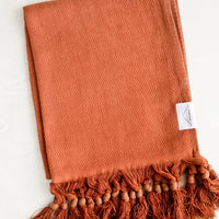 Cinnamon: A turkish hand towel in cinnamon hue with tonal fringed trim.