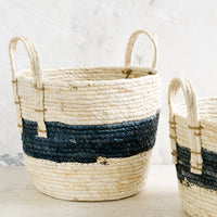 3: Storage baskets woven from natural maize with indigo band around center.
