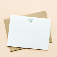 Potted Plant: A kraft envelope with white notecard and small icon of a potted plant printed at top.