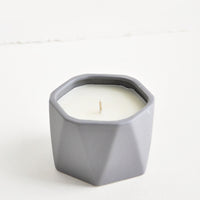 Blackberry Absinthe: A small candle in dark grey faceted ceramic vessel.