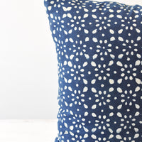 2: A detail shot of a square indigo and white block printed pillow.