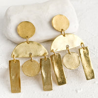 3: A pair of gold earrings with geometric chandelier design.