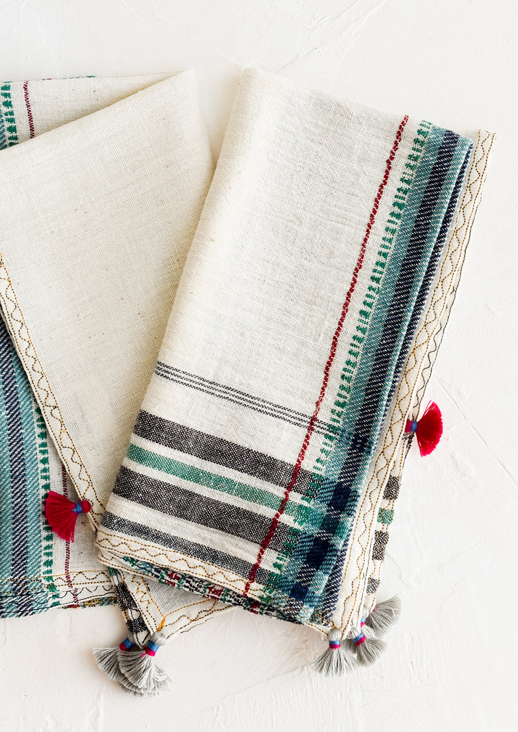 3: A pair of khadi cotton napkins with tassel detailing.
