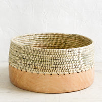 Large: A wide, shallow bowl made from half wood and half woven grass with black thread.