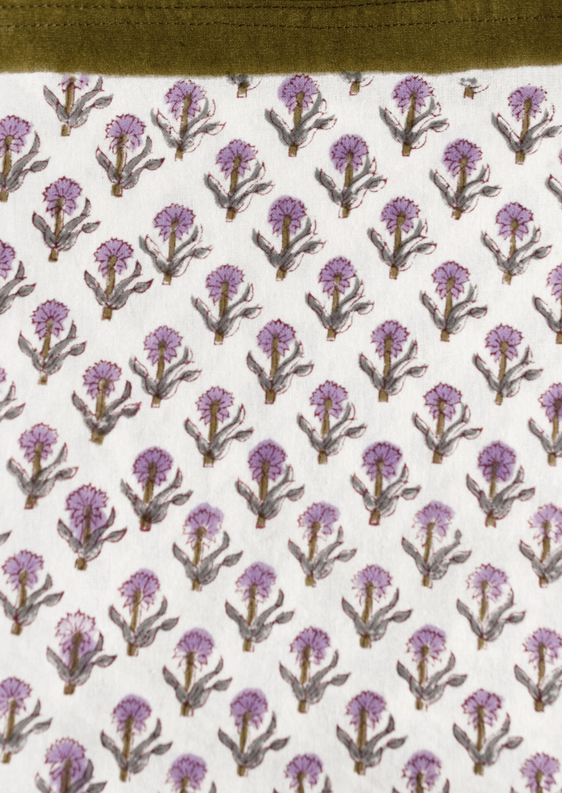 A purple and olive green floral print tablecloth.