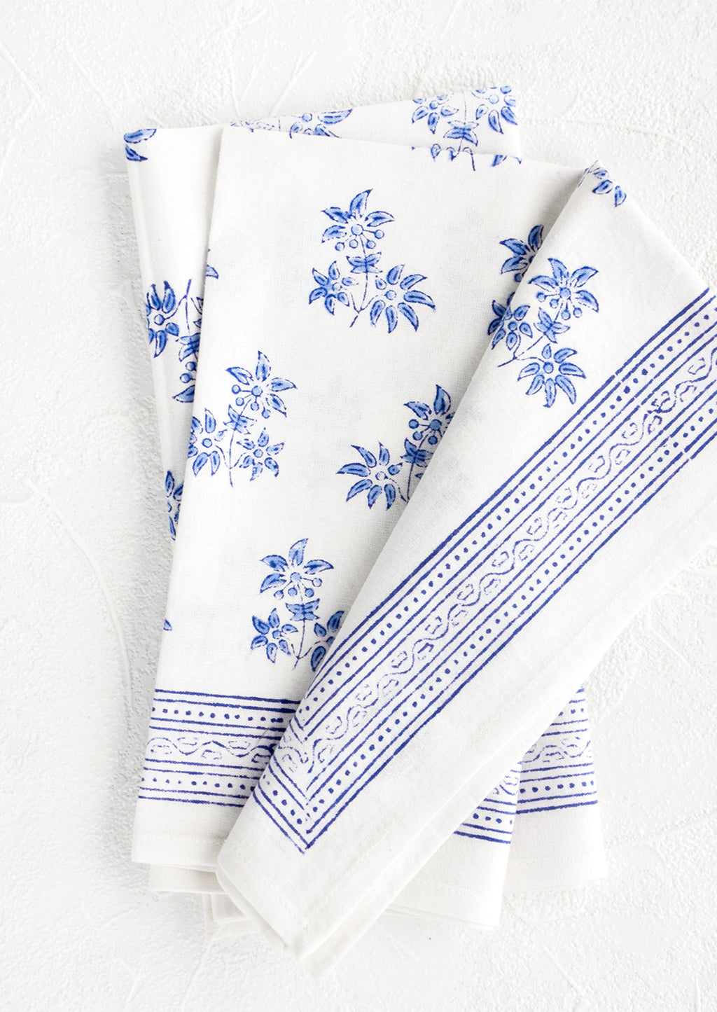 1: Pair of block printed cotton dinner napkins with blue floral pattern