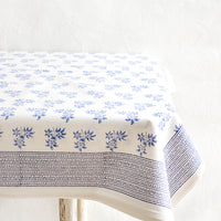2: White cotton tablecloth with blue floral print and patterned border