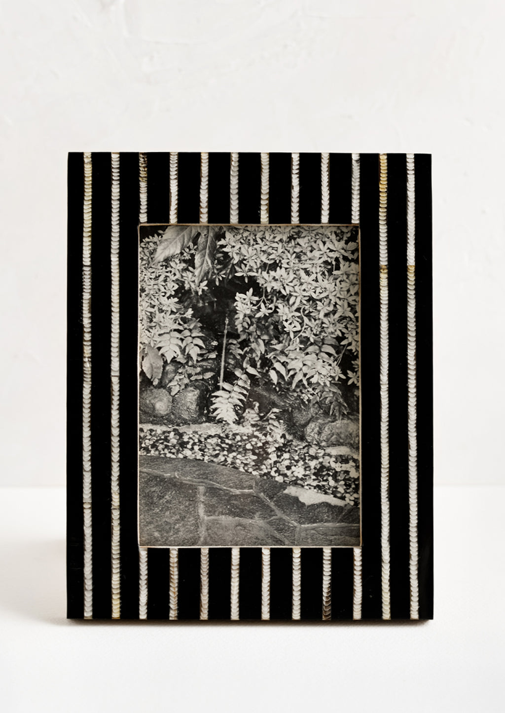 1: A black and white striped picture frame.