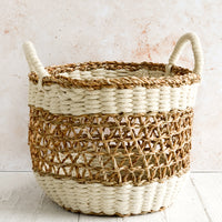 Medium [$85.00]: A medium open-top round storage basket made from seagrass with braided jute, featuring two handles at top.