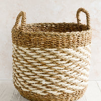 Large [$98.00]: A large open-top round storage basket made from seagrass with braided jute, featuring two handles at top.