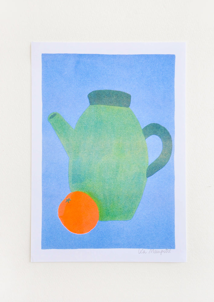 1: Still life of a green teapot and an orange against a bright blue background.