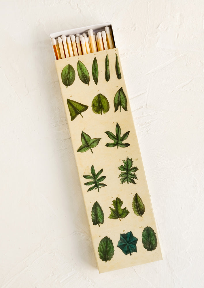 Extra long matchstick box with leaf print container and white tipped matches.