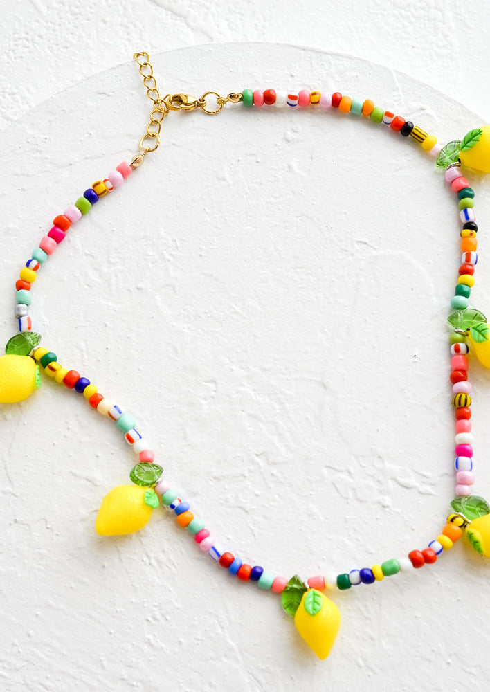 1: A beaded necklace with colorful seed beads and lemon beads.