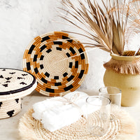 4: Variety of tabletop home decor in a neutral, earthy palette