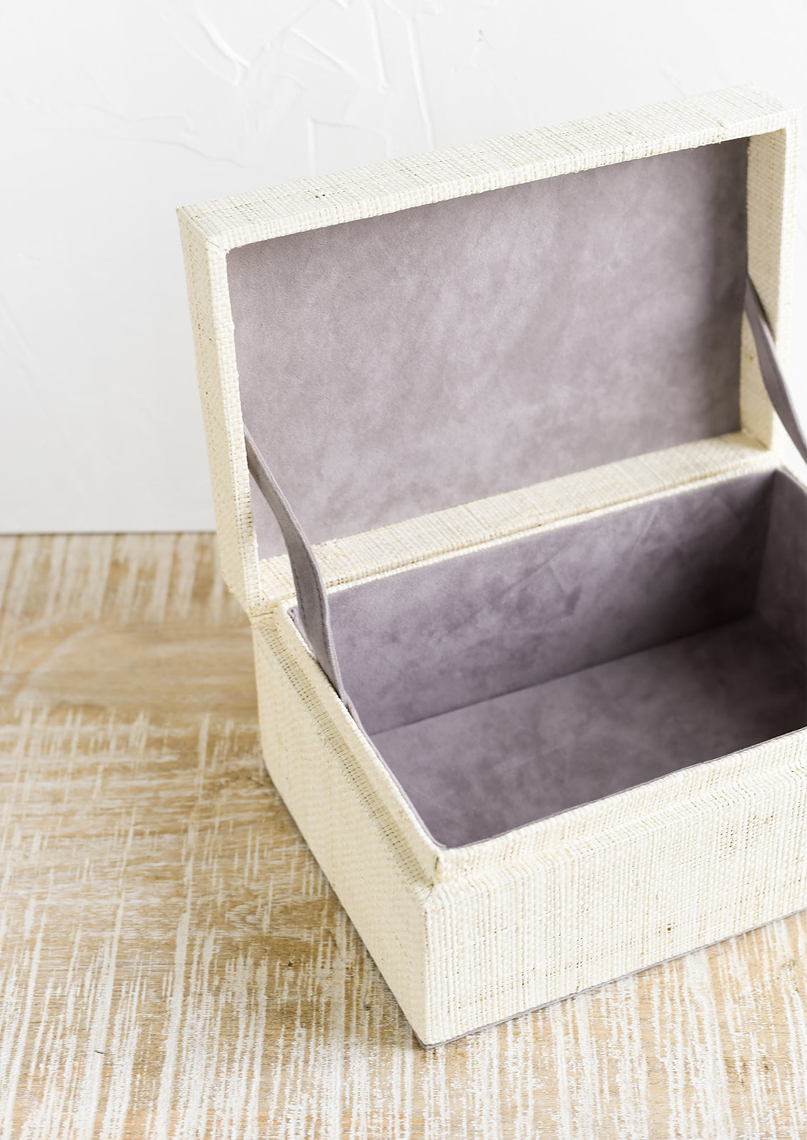 Microfiber lined storage box with hinges.