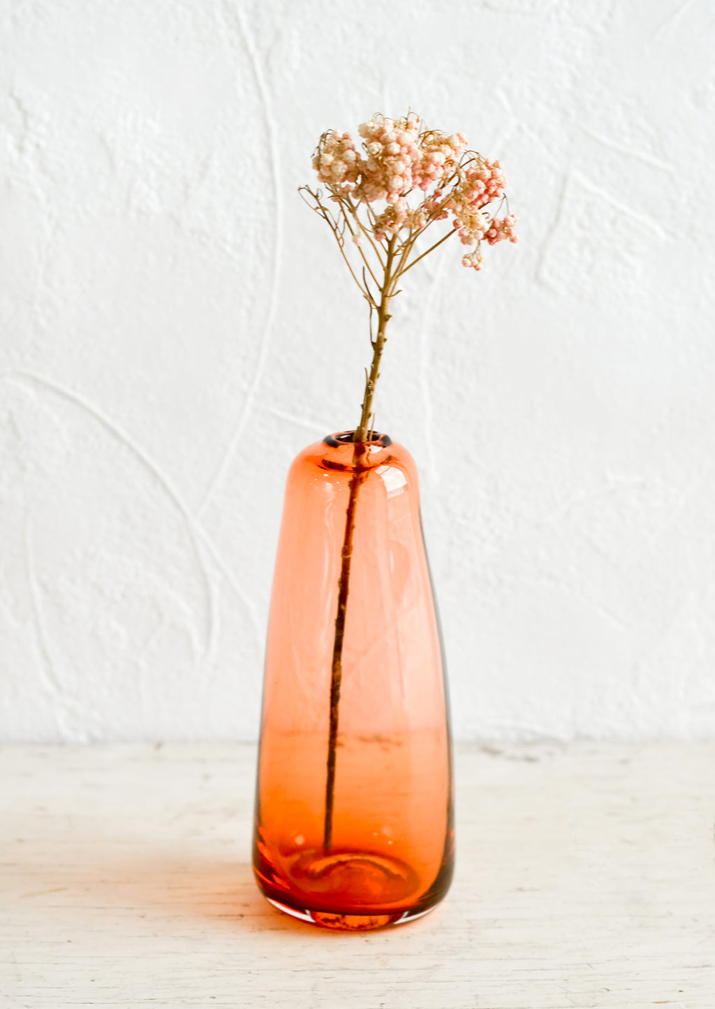 Cherry / Tall: A tall glass bud vase in translucent red-orange.