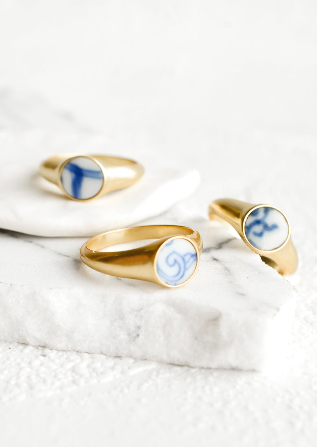 2: Gold signet rings with blue and white pottery signet.