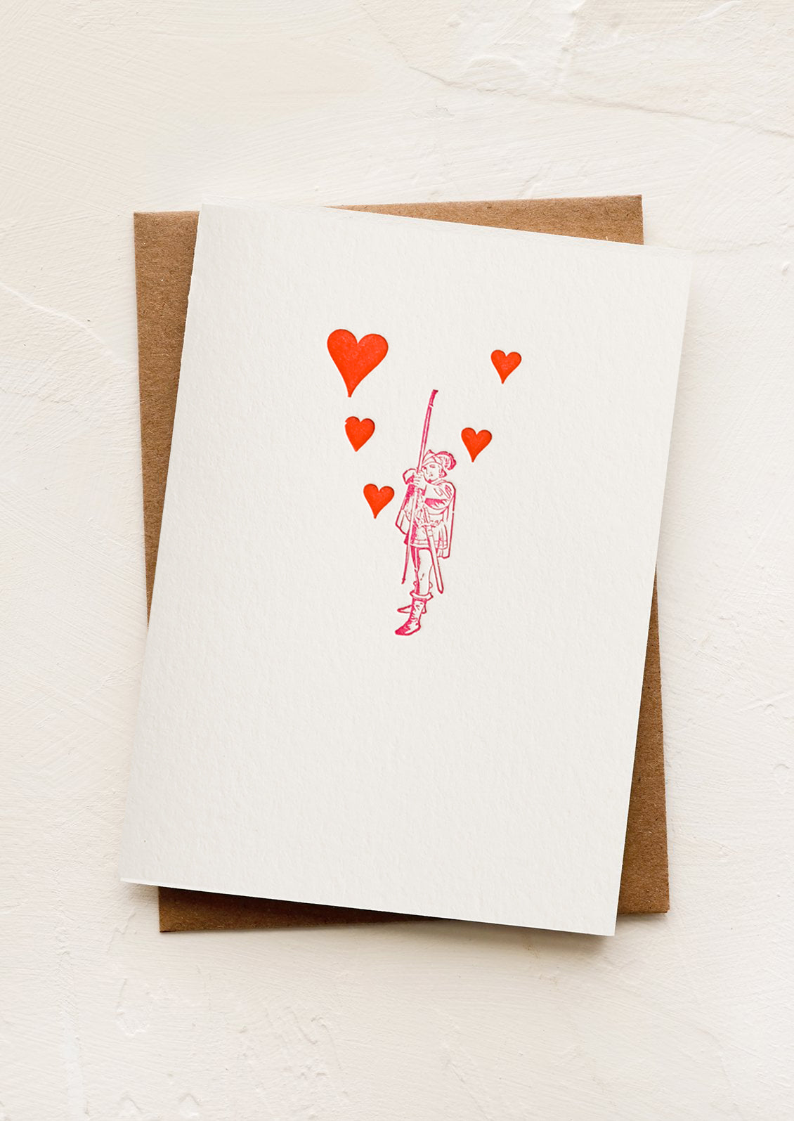 A greeting card with image of man shooting arrows.