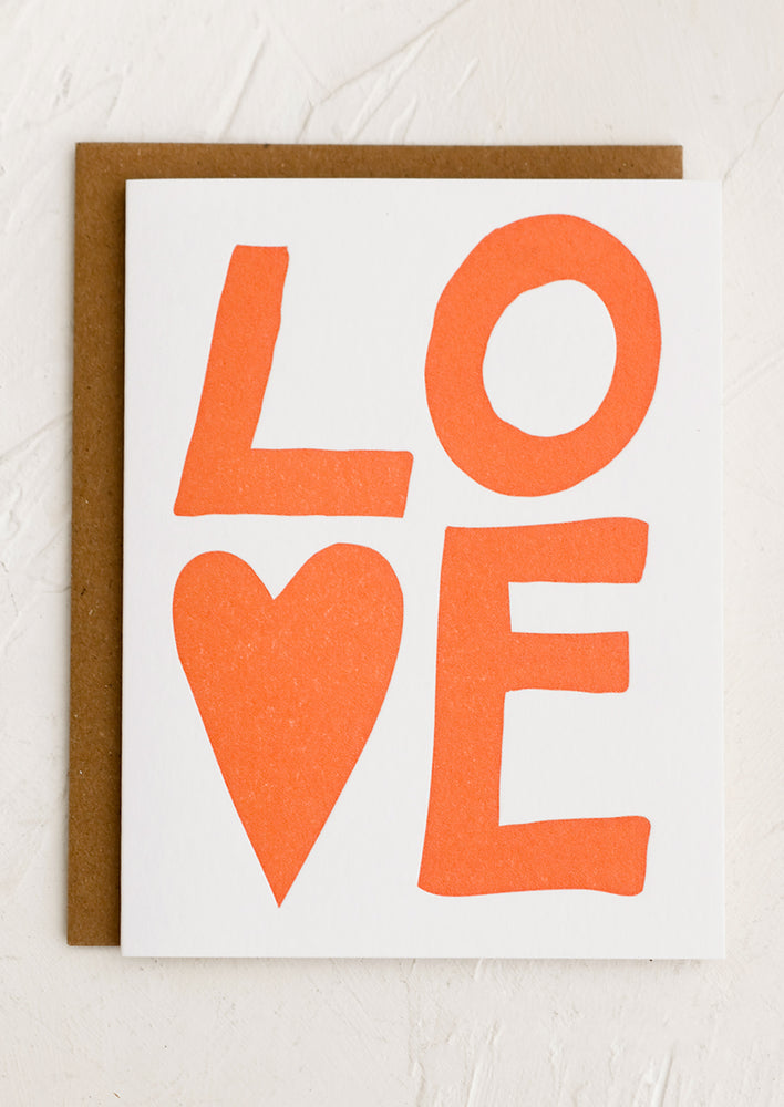 A card with big red lettering reading "LOVE", v is a heart.
