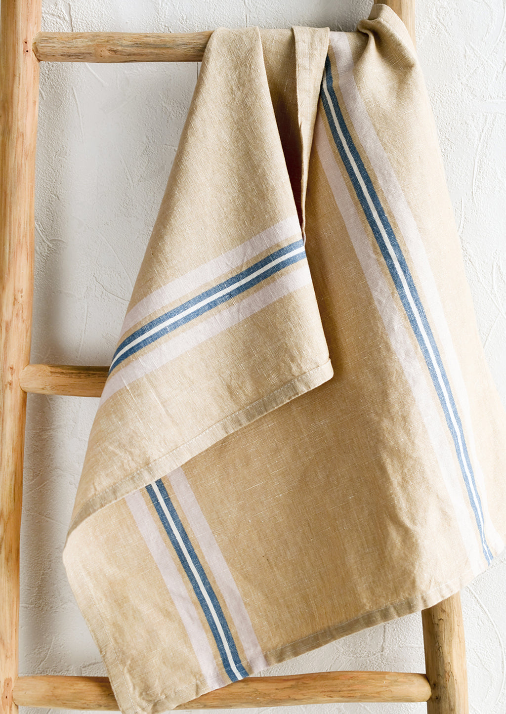 Pink / White / Blue: A tan tea towel with blue, pink and white vertical stripe.