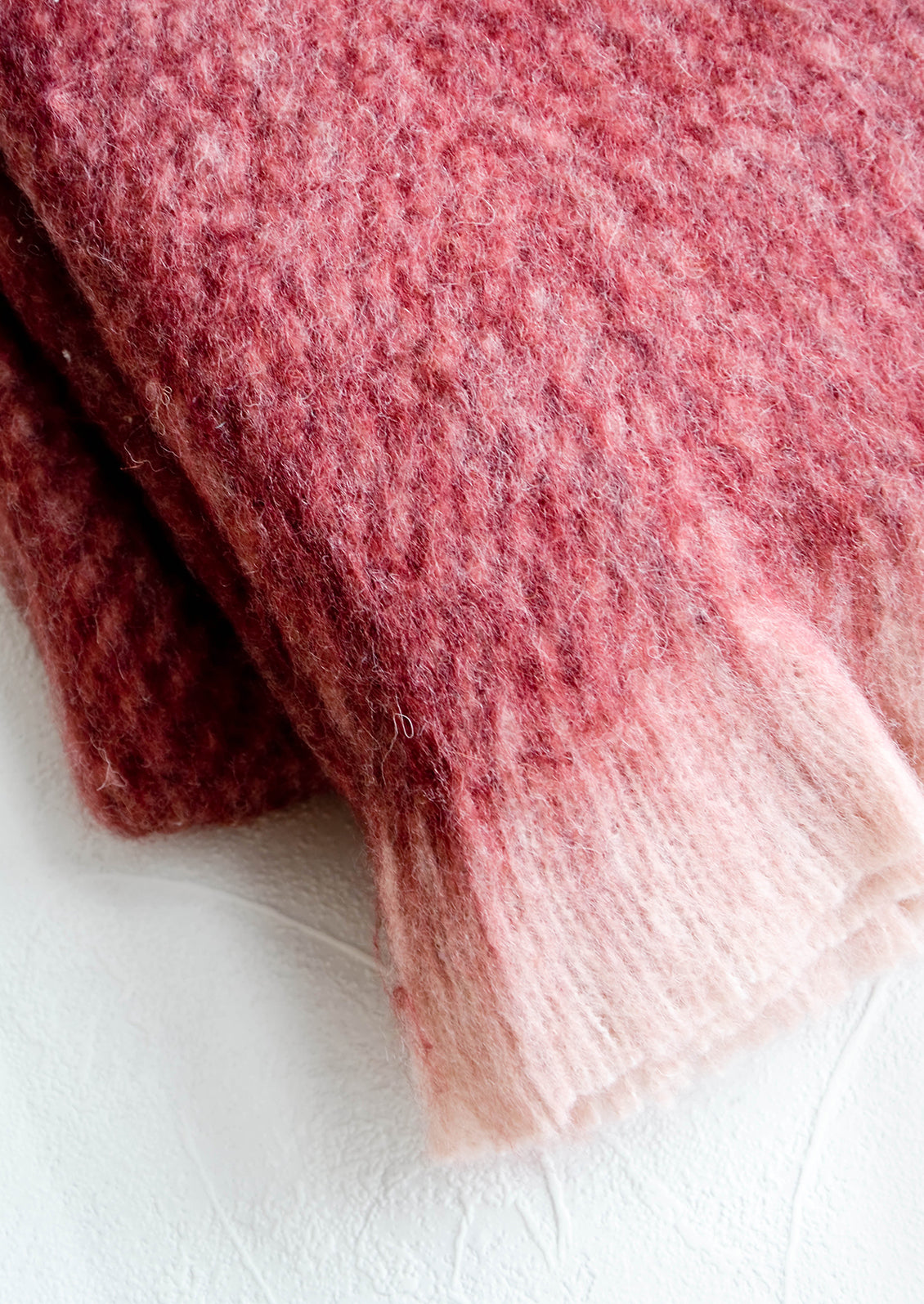 Plush, fuzzy mohair-like fabric with eyelash trim