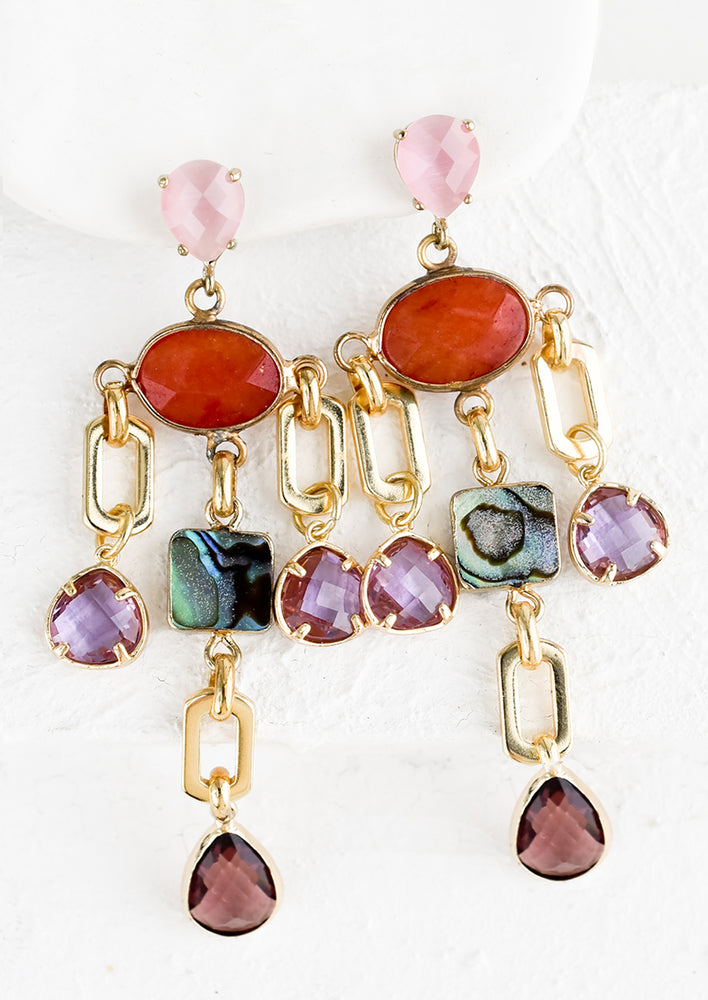 A pair of drop earrings with chandelier like silhouette in mix of pink and abalone stones.