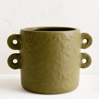 1: An army green round planter with decorative loop handles at sides.