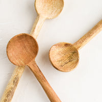 1: Three carved wooden teaspoons in slightly different wood colors.