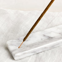 1: A long solid marble incense burner tray.