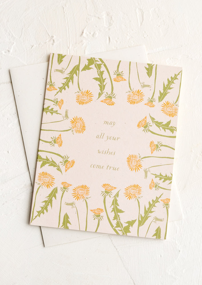 A greeting card with text reading "May all your wishes come true".
