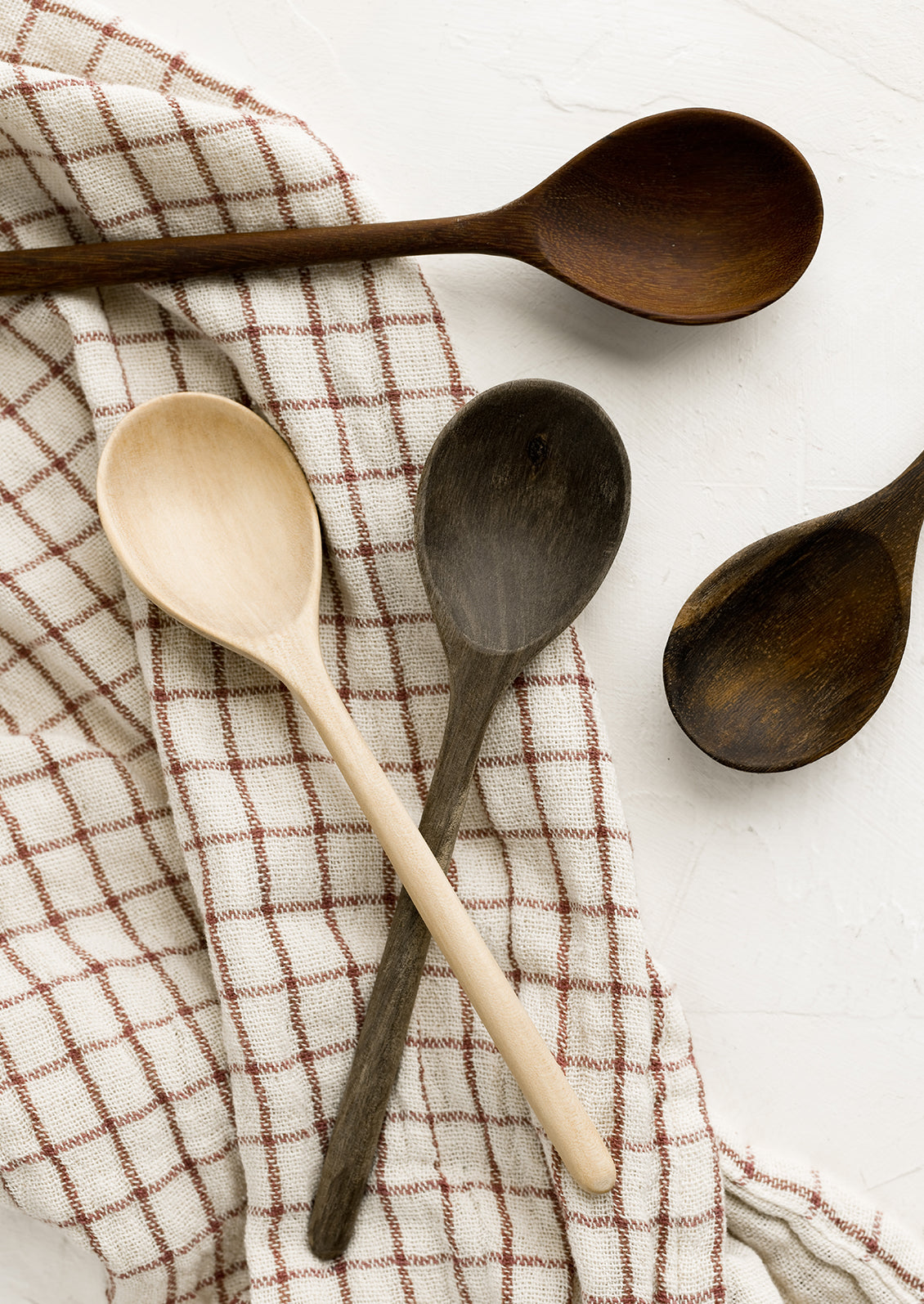 Wooden spoons in assorted wood tones.