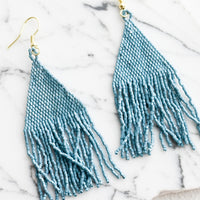 Oceanic: Metallic light blue triangular fringe beaded earrings.