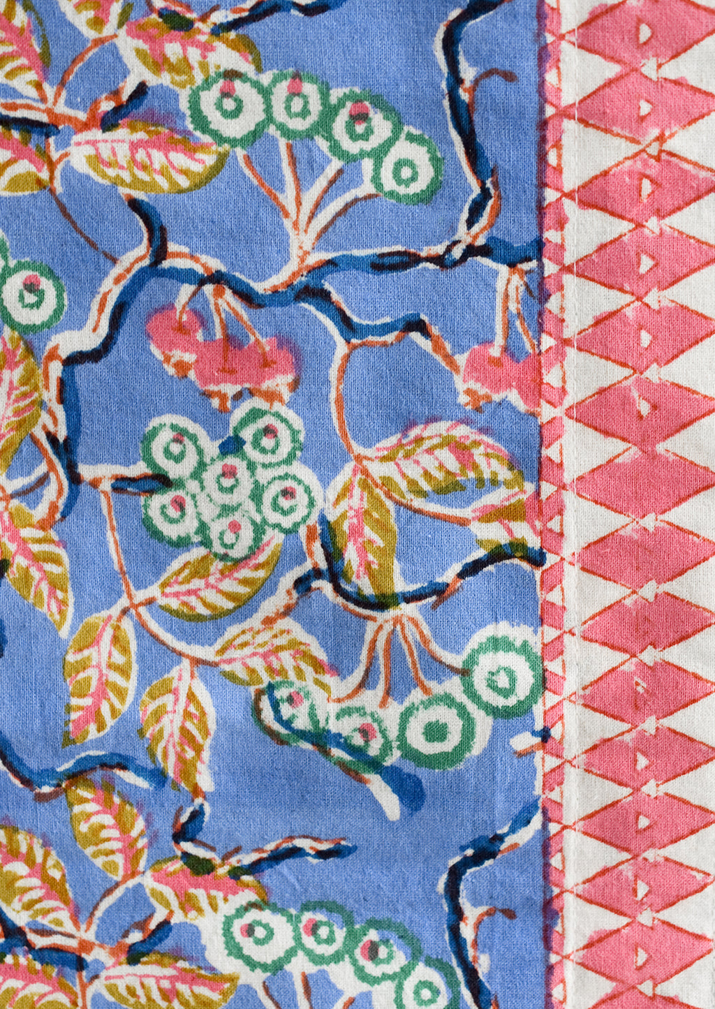 2: A block printed table runner in blue and pink floral.