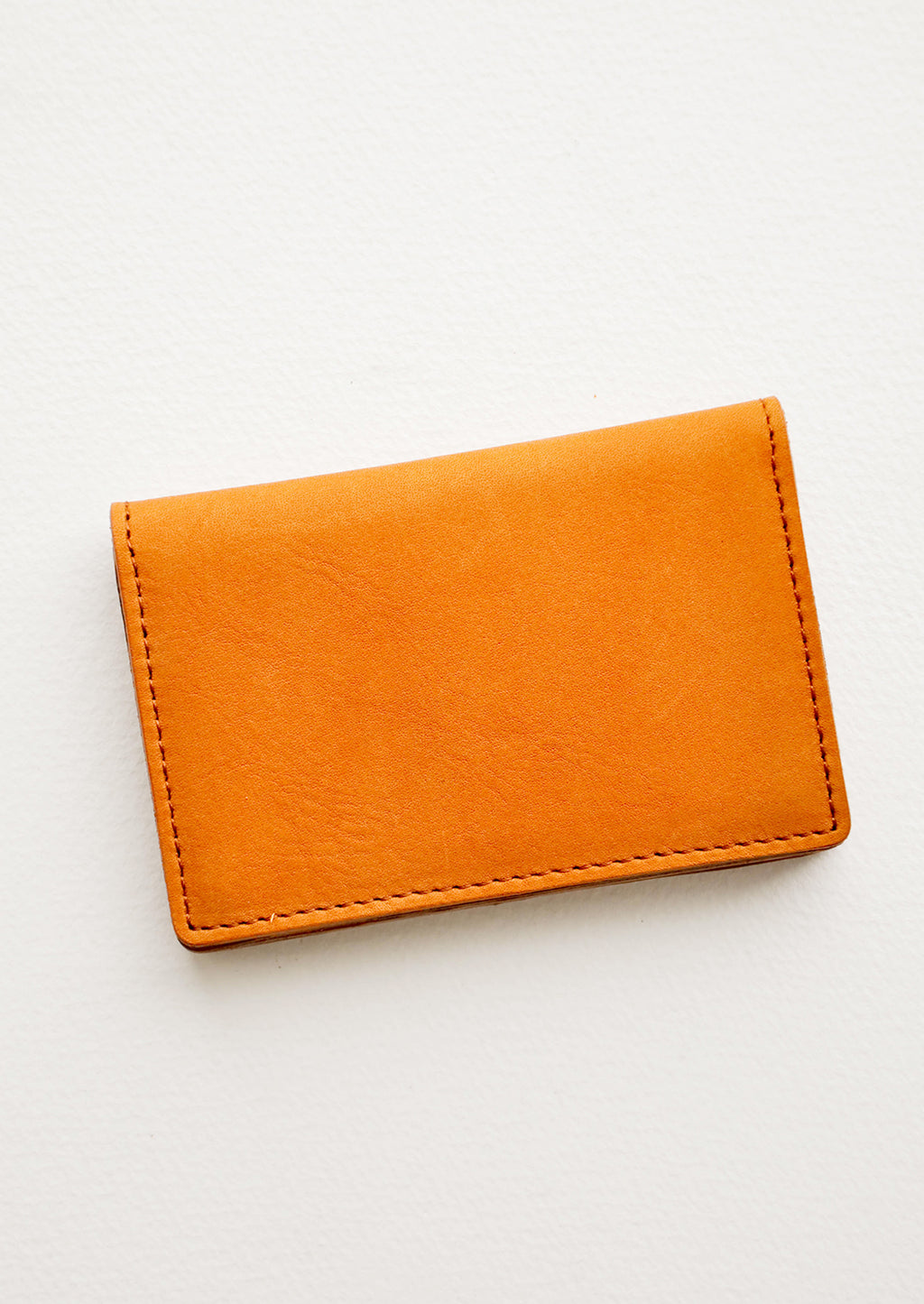 Oiled Saddle: A small leather cardholder wallet in tanned leather.