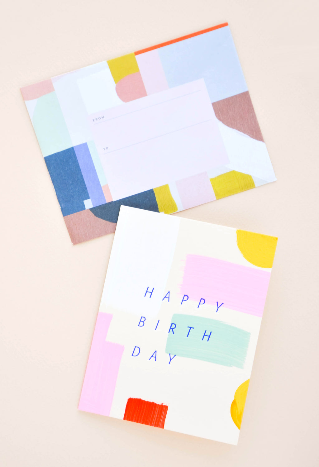 2: Greeting card with hand-painted colorful brushstrokes and "Happy Birthday" printed in cobalt blue