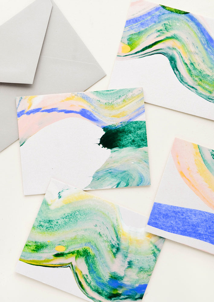Hand painted all-purpose greeting cards with blue-green paint swirl patterns, each one unique.