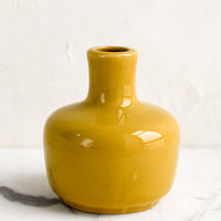 Short / Mustard: A ceramic bud vase in short shape, mustard color.