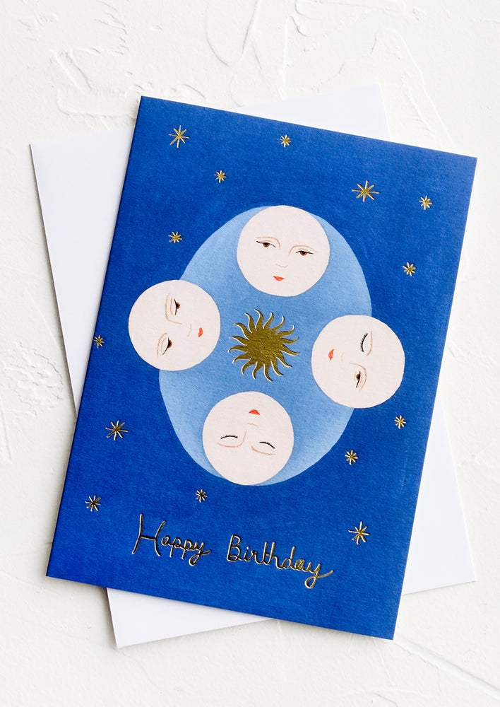 1: A blue greeting crd with image of stars and moon and text reading "happy birthday".