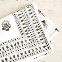 2: Folded cotton tablecloth in white with block printed Indian floral pattern