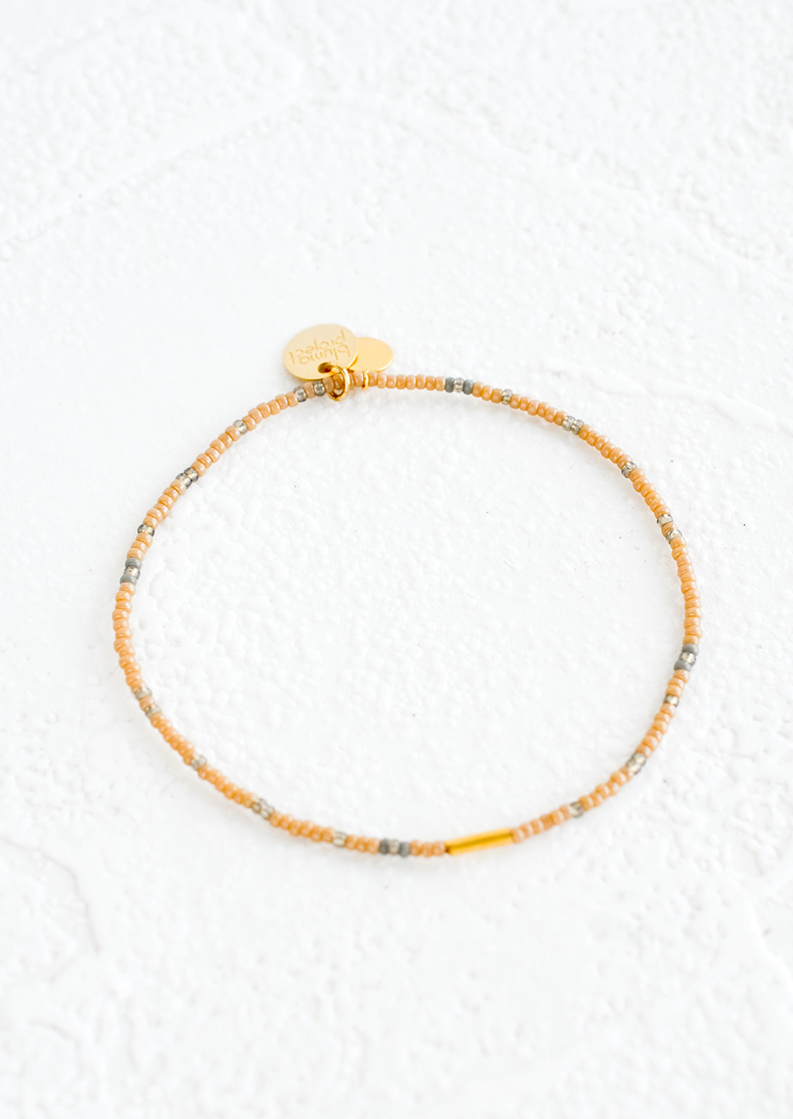 Seed bead bracelet in tan and grey with brass accents