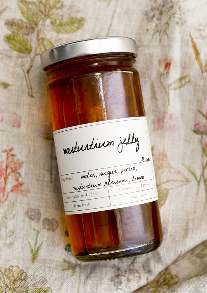 1: A glass jar of nasturtium jelly.