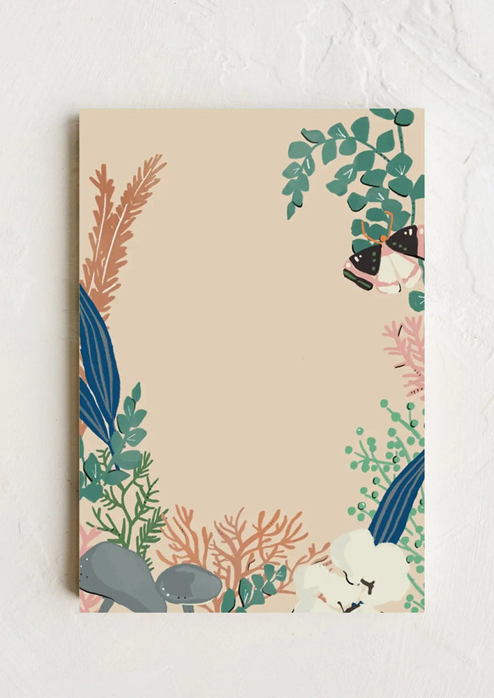 1: A botanical print notepad with plants, coral and butterfly.