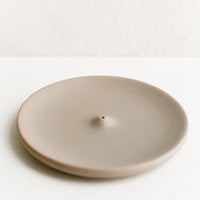 Matte Taupe: A round ceramic incense holder in matte taupe