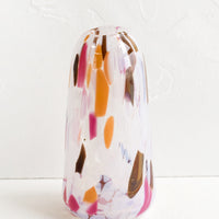 Tapered: A tall tapered bud vase in glass with orange, brown and pink speckles.