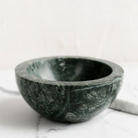 Green: A small green marble bowl.