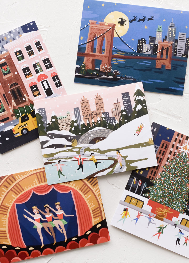 An illustrated card set with different holiday NYC scenes