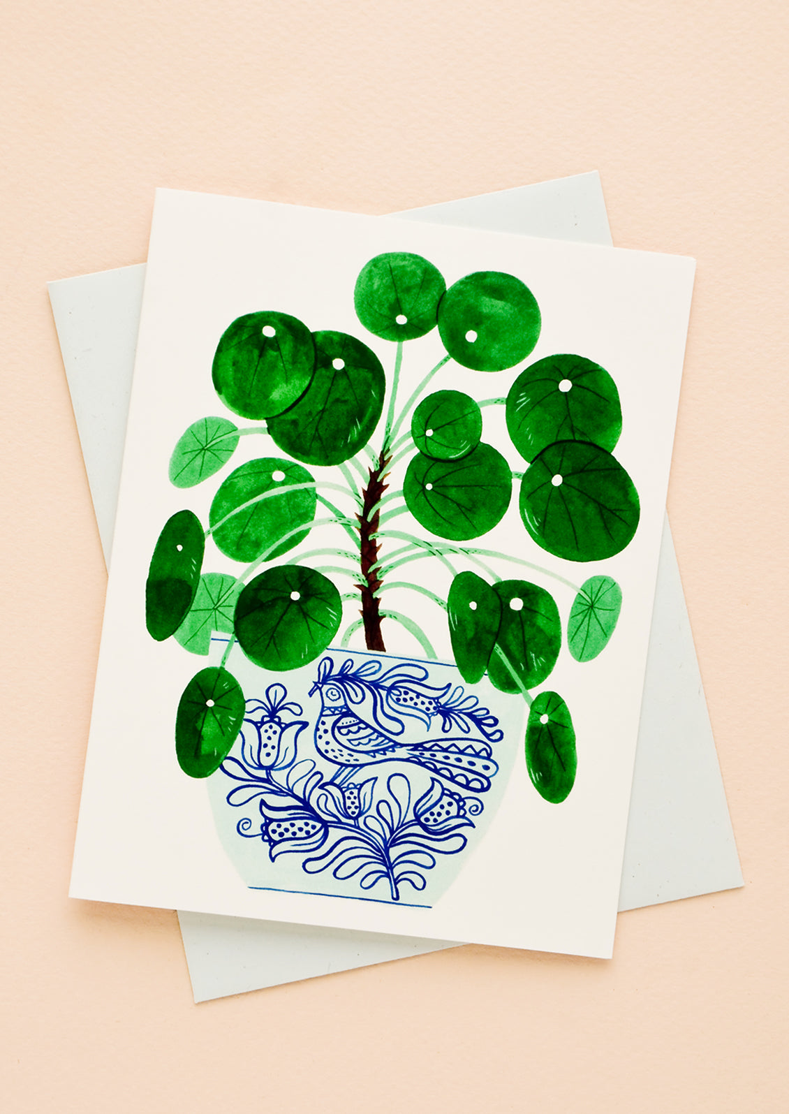 Greeting card with potted pilea plant printed on front, paired with light blue envelope